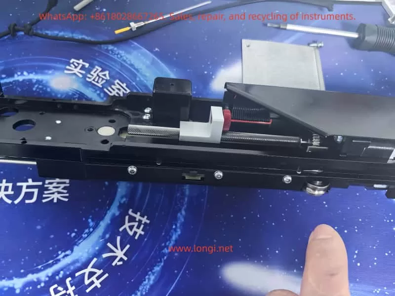 Internal Z-axis transmission assembly of CTC autosampler including lead screw, cable pulley, tension spring, and reference sensing mechanism