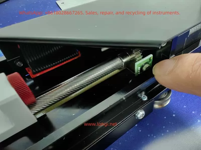 Z-axis drive mechanism of CTC autosampler showing steel cable, gear shaft, and Hall sensor used for Z-axis reference detection