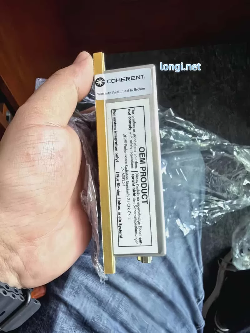 Side profile of Coherent Sapphire laser module showing OEM product warning and DB25 connector