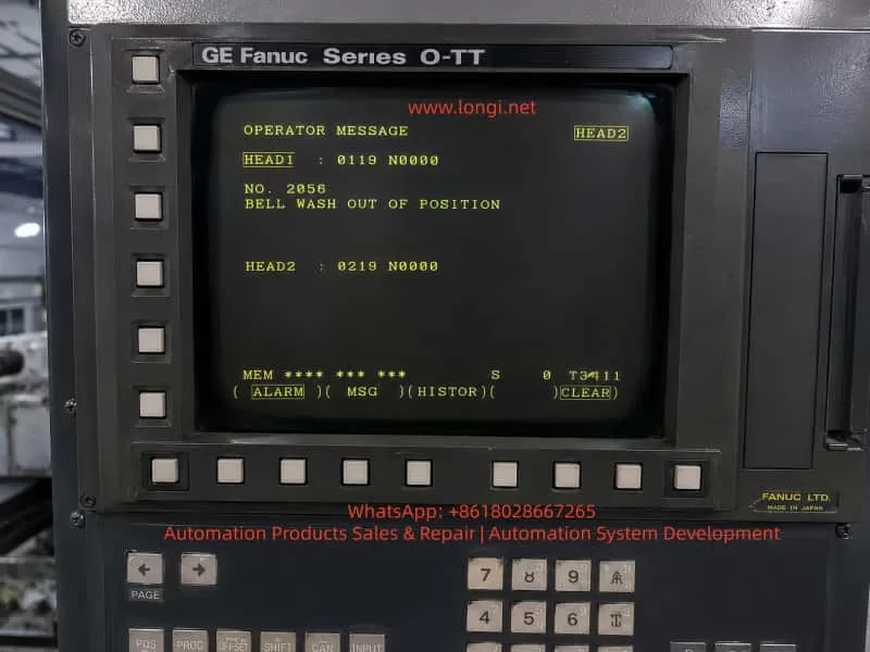 GE Fanuc Series O-TT twin-channel CNC lathe control panel displaying NO.2056 BELL WASH OUT OF POSITION operator alarm message