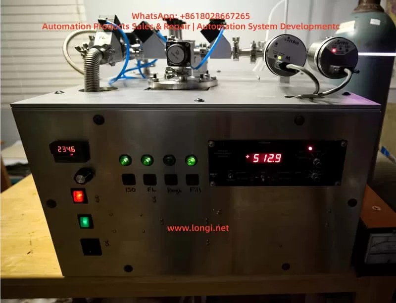 Laboratory vacuum equipment front view with MKS pressure readout, digital temperature controller, indicator lights, vacuum valves, pneumatic tubing, and pressure sensors mounted on the top panel.