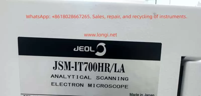 Close-up of the JEOL JSM-IT700HR/LA nameplate showing the model number and analytical scanning electron microscope identification label made in Japan.