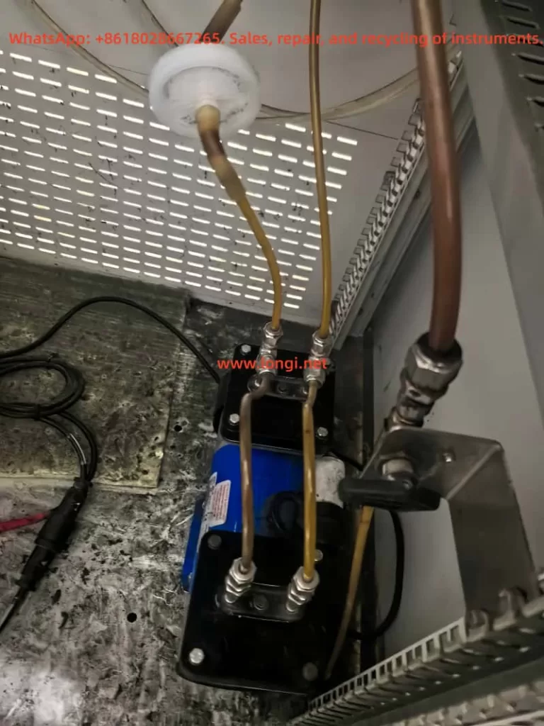 Sampling pump and contaminated yellow gas tubing inside an SBI single burning item test gas analysis system