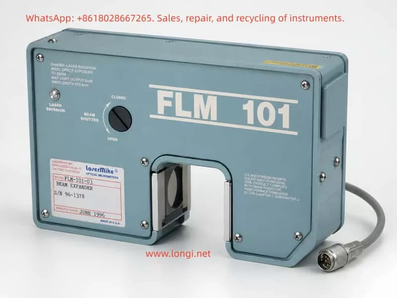 LaserMike FLM-101-03 laser beam expander optical micrometer module with blue metal housing, beam shutter control, optical aperture, and multi-pin cable connector shown in a professional product view.