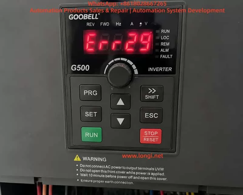 Close-up view of a GOOBELL G500 industrial frequency inverter control panel displaying an ERR29 fault code, with keypad buttons including RUN, STOP/RESET, PRG, and navigation keys, indicating a communication-related fault state on power-up.