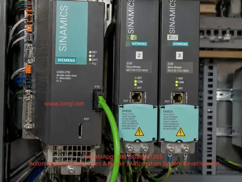 Siemens SINAMICS S120 CU320-2 PN control unit and Motor Modules installed in an industrial electrical cabinet with DRIVE-CLiQ connections and power module wiring.